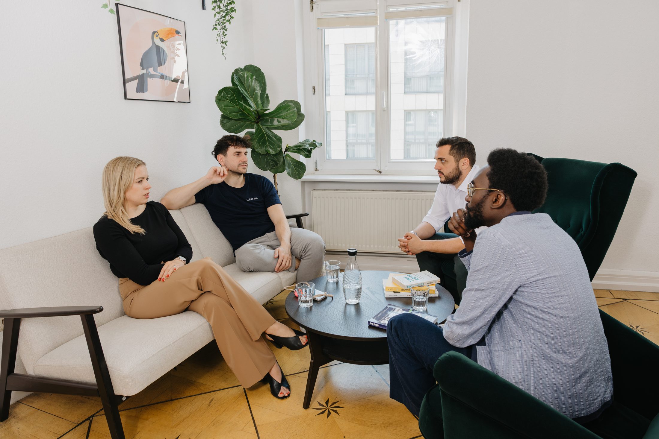 Gemmpions talking in the office lounge
